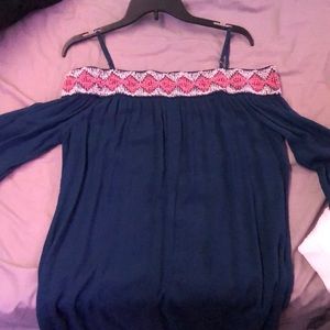 Size Medium off the shoulder with straps dark navy blue with pattern on top.